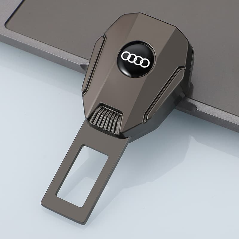 Black Audi car seat belt extender, featuring a black seat belt extender adorned with the Audi logo. Perfect for Audi car owners looking to improve seat belt convenience, this premium auto accessory merges elegance and utility for an enhanced driving experience.
