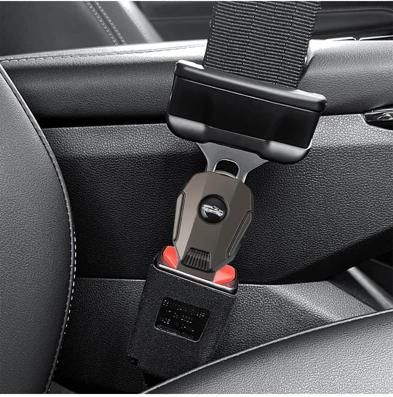 Black car seat belt extender in use, installed in a car's seat belt system. This auto accessory is designed to improve seat belt comfort and convenience, making it easier for drivers and passengers to fasten their seat belts securely and comfortably.