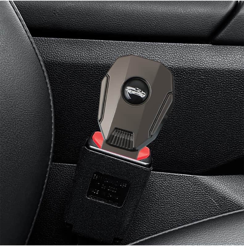 Black car seat belt extender in use, attached to a car's seat belt buckle. This auto accessory is designed to enhance seat belt convenience and safety, making it easier for drivers and passengers to fasten their seat belts comfortably and securely.