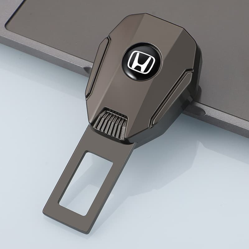 Black Honda car seat belt extender, featuring a black seat belt extender with the Honda logo. Great for Honda vehicle owners wanting to boost seat belt usability, this top - notch auto accessory blends style and practicality for a more pleasant driving experience.