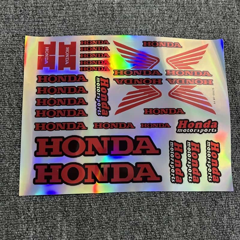 Holographic sticker sheet with multiple red - colored Honda and Honda Motorsports logos, great for customizing Honda motorcycles and vehicles to show a sporty look.