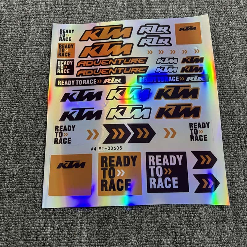 Holographic sticker sheet with KTM "Ready To Race" graphics and various KTM - branded decals for motorcycle and vehicle customization
