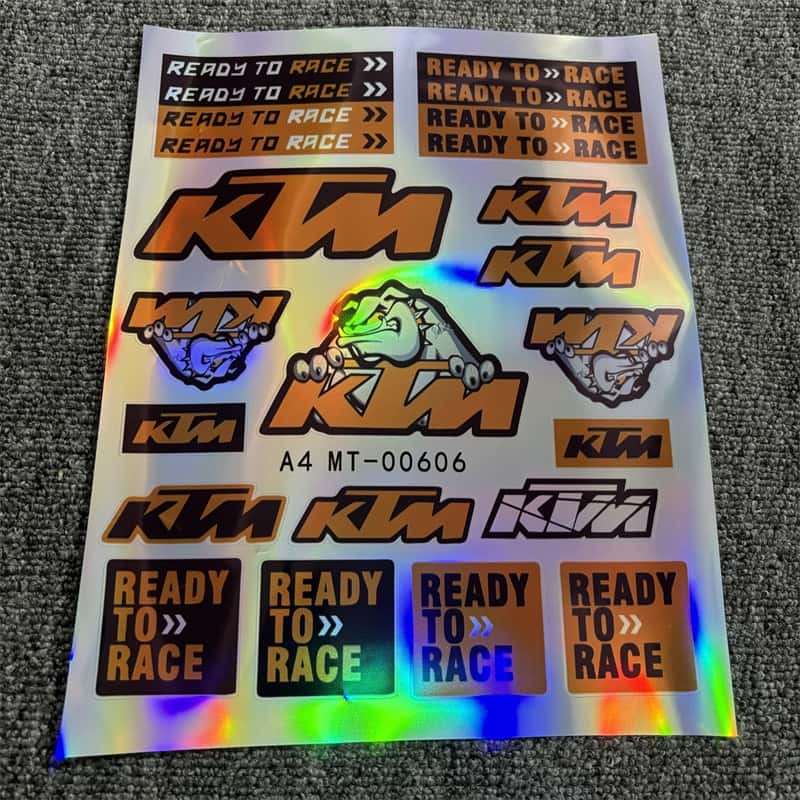 Holographic sticker sheet featuring multiple KTM "Ready To Race" texts and KTM logo designs, perfect for customizing KTM motorcycles to show a racing - ready style.