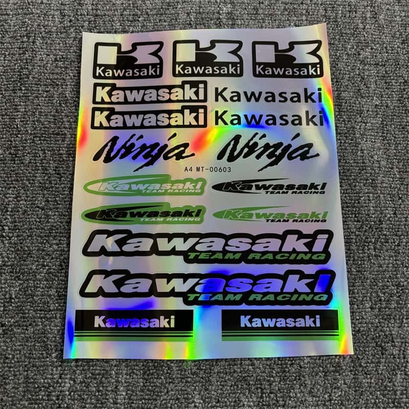 Holographic sticker sheet with multiple Kawasaki logos, Ninja designs, and Kawasaki Team Racing branding, ideal for customizing Kawasaki motorcycles to showcase a racing - inspired style.
