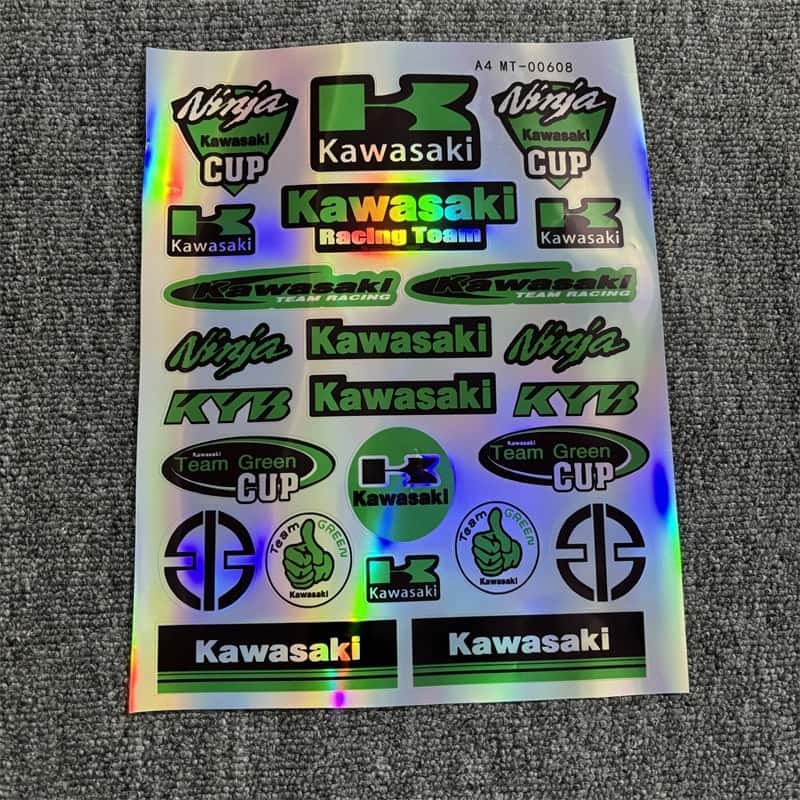 Holographic sticker sheet featuring Kawasaki Racing Team logos, Ninja Cup designs, and Team Green elements, suitable for customizing Kawasaki motorcycles.