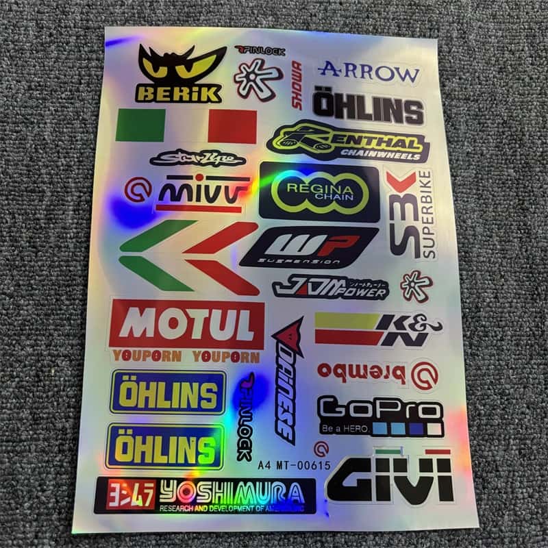 Holographic sticker sheet with motorcycle racing brands like Motul, Öhlins, and Brembo, ideal for customizing motorcycles and vehicles to show a racing - inspired style.