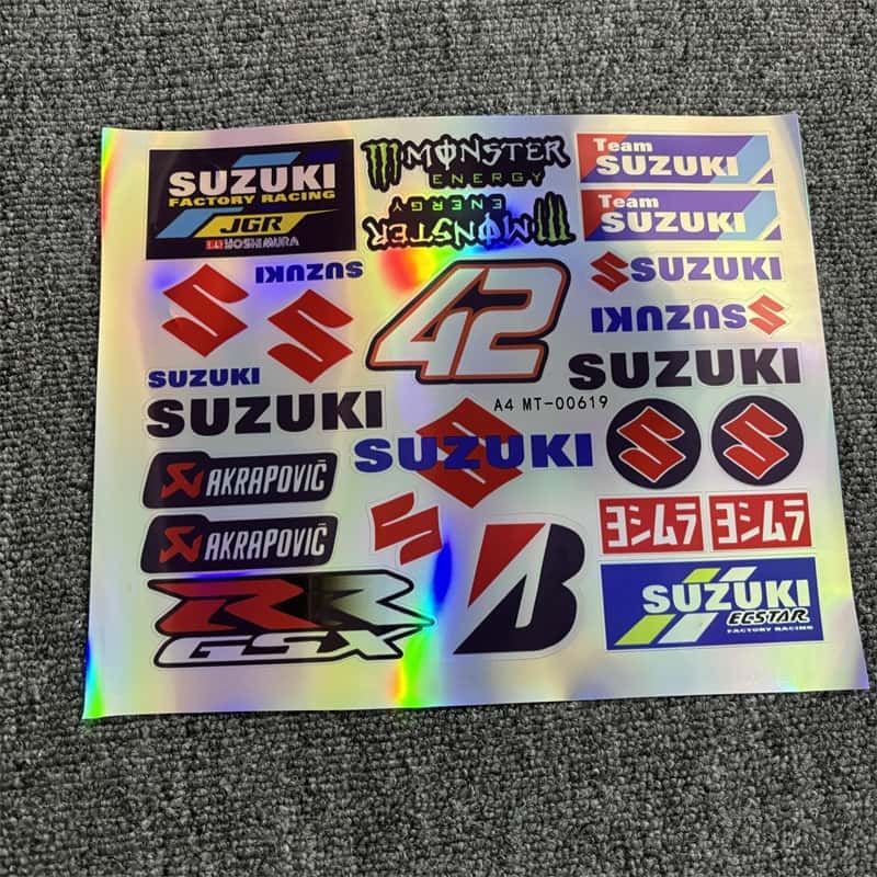 Holographic sticker sheet with Suzuki logos, GSX designs, and Monster Energy branding, perfect for customizing Suzuki motorcycles.