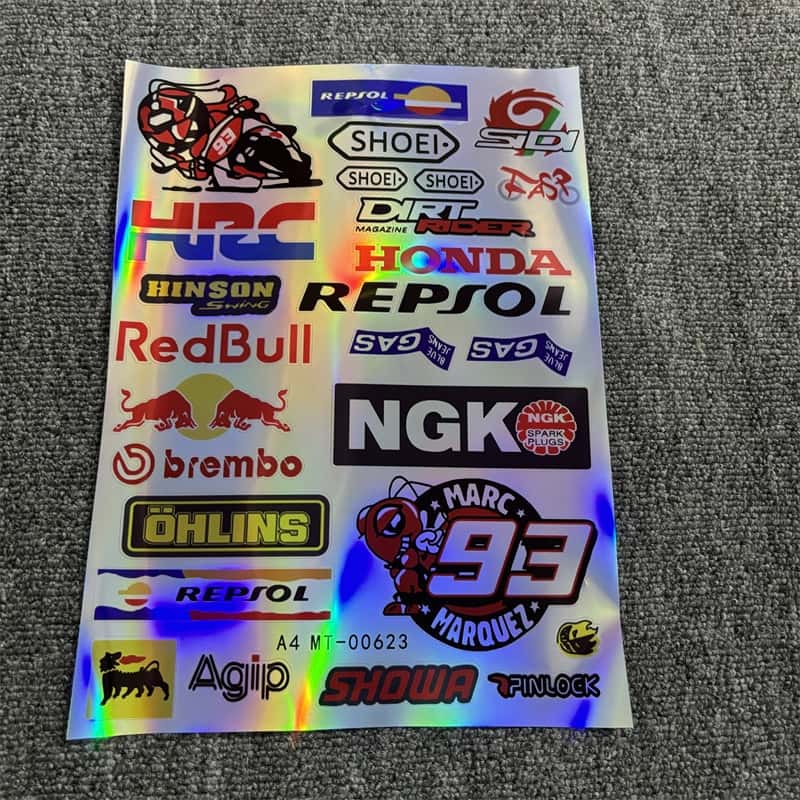 Laser sticker sheet with multiple Honda - related logos, including Repsol, Red Bull, and other associated brands like Brembo and Ohlins. Ideal for customizing Honda motorcycles to showcase a racing - inspired style with laser visual effects.