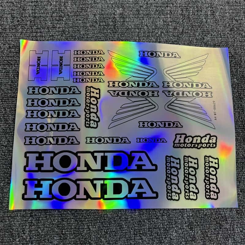 Laser sticker sheet featuring various Honda logos and Honda Motorsports text, suitable for customizing Honda motorcycles to give them a sporty and racing - inspired appearance.